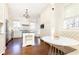 Spacious kitchen featuring white cabinets, stainless steel appliances, a center island, and a breakfast nook at 57 Rumson Ne Way, Atlanta, GA 30305