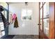 Functional mudroom featuring tile flooring, a window, and coat hooks at 57 Rumson Ne Way, Atlanta, GA 30305