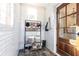 Bright mudroom with white subway tile walls, slate flooring and a coat rack near the front door at 57 Rumson Ne Way, Atlanta, GA 30305