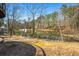 Landscaped backyard with a pond and a charming gazebo at 724 Laurel Chase Sw, Marietta, GA 30064