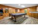 Basement with a pool table and a vintage arcade game at 724 Laurel Chase Sw, Marietta, GA 30064