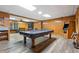 Spacious finished basement with hardwood floors, a pool table, and a vintage arcade game at 724 Laurel Chase Sw, Marietta, GA 30064