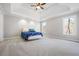 Spacious bedroom with trey ceiling, carpet, and large windows at 724 Laurel Chase Sw, Marietta, GA 30064