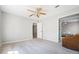 Bedroom featuring a ceiling fan and access to a sitting area at 724 Laurel Chase Sw, Marietta, GA 30064