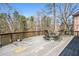 Outdoor deck with seating, overlooking mature trees and backyard at 724 Laurel Chase Sw, Marietta, GA 30064