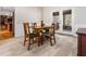 Cozy dining area featuring a wooden table, carpeted floor, and view of outdoor patio through glass doors at 724 Laurel Chase Sw, Marietta, GA 30064