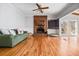 Cozy living room with hardwood floors, brick fireplace, and large windows at 724 Laurel Chase Sw, Marietta, GA 30064