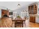 Bright living room with a brick fireplace, hardwood floors, and large windows at 724 Laurel Chase Sw, Marietta, GA 30064