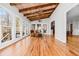 Beautiful sun room with many windows, hardwood floors, and comfortable seating at 724 Laurel Chase Sw, Marietta, GA 30064