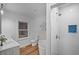 Modern bathroom with double sink vanity, soaking tub, tiled shower, and stylish fixtures at 1027 Mount Airy Sw Dr, Atlanta, GA 30311