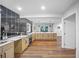 Spacious kitchen with light wood cabinets, stainless steel appliances and black tiled wall at 1027 Mount Airy Sw Dr, Atlanta, GA 30311