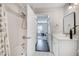 Bright bathroom with white vanity, bathtub, and view into the bedroom at 1074 Peachtree Ne Walk # B306, Atlanta, GA 30309