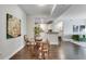 Open concept dining area featuring a round glass table, wicker chairs and adjacent breakfast bar at 1074 Peachtree Ne Walk # B306, Atlanta, GA 30309