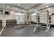 Spacious gym area featuring weightlifting equipment, benches, and television at 1074 Peachtree Ne Walk # B306, Atlanta, GA 30309