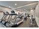 Bright gym featuring modern treadmills, stationary bikes, and a mirror reflecting exercise equipment at 1074 Peachtree Ne Walk # B306, Atlanta, GA 30309