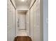 Hallway features hardwood floors, closet space, and a view of a bathroom at 1074 Peachtree Ne Walk # B306, Atlanta, GA 30309