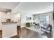 Living room area with stylish furnishings, geometric rug, and sliding glass doors to outdoor balcony at 1074 Peachtree Ne Walk # B306, Atlanta, GA 30309