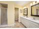 Bright bathroom featuring a walk-in shower and double sink vanity at 1883 Acuba Ln, Atlanta, GA 30345