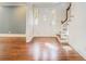 Bright foyer with hardwood floors, a stained glass front door, and staircase with wooden railing at 1883 Acuba Ln, Atlanta, GA 30345