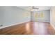 Spacious living room featuring hardwood floors, a ceiling fan, and lots of natural light at 1883 Acuba Ln, Atlanta, GA 30345