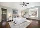 Comfortable main bedroom with a window seat and ceiling fan at 1883 Acuba Ln, Atlanta, GA 30345