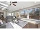 Bright sunroom with hardwood floors, large windows, skylights, and access to the deck at 1883 Acuba Ln, Atlanta, GA 30345