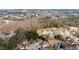 An aerial view of a residential neighborhood surrounded by lush greenery and mature trees at 2405 Landrum Ct, Lawrenceville, GA 30043