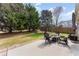 Backyard patio featuring a fire pit and lots of green space at 2405 Landrum Ct, Lawrenceville, GA 30043