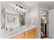 Bathroom featuring double vanity, shower, and soaking tub at 2405 Landrum Ct, Lawrenceville, GA 30043