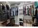 Walk in closet with shelving and clothing at 2405 Landrum Ct, Lawrenceville, GA 30043