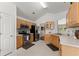 Well-lit kitchen with stainless steel appliances, light wood cabinets, and a view to the breakfast area at 2405 Landrum Ct, Lawrenceville, GA 30043