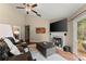 Cozy living room featuring a fireplace, hardwood floors, and large windows for natural light at 2405 Landrum Ct, Lawrenceville, GA 30043