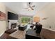 Comfortable living room featuring hardwood floors, a fireplace, and access to the outdoor patio at 2405 Landrum Ct, Lawrenceville, GA 30043