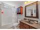 Bathroom features a vanity with a framed mirror and a shower/tub combination at 2999 Paul Harris Rd, Dallas, GA 30157