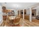 Open kitchen and dining area with hardwood floors and stainless steel appliances at 2999 Paul Harris Rd, Dallas, GA 30157