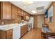 Traditional kitchen with oak cabinets, white appliances, and laminate countertops at 2999 Paul Harris Rd, Dallas, GA 30157