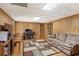 Wood-paneled living room with hardwood floors, area rug, and comfortable seating at 2999 Paul Harris Rd, Dallas, GA 30157