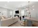 Bright, open living room featuring hardwood floors, modern decor, and a dining area at 1057 Fortress Sw Ave, Atlanta, GA 30315