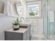 Bathroom featuring a tiled shower, stylish vanity, and a bright window at 1848 Flagler Ne Ave, Atlanta, GA 30309