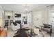 Bright living room with a fireplace, built-in shelving, and an abundance of natural light at 1848 Flagler Ne Ave, Atlanta, GA 30309