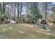 Spacious backyard featuring a storage shed and a wooden playset for outdoor fun at 2031 Audubon Ne Dr, Atlanta, GA 30329