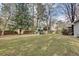 Large backyard with a playset and a wooden fence surrounding the perimeter at 2031 Audubon Ne Dr, Atlanta, GA 30329