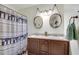 Stylish bathroom with a double vanity and an unique patterned shower curtain at 2031 Audubon Ne Dr, Atlanta, GA 30329