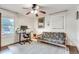 Bedroom features hardwood floors, bright lighting, desk, futon and large window at 2031 Audubon Ne Dr, Atlanta, GA 30329