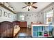 Sunny bedroom with hardwood floors, two beds, built-in shelving, and playful wall decor at 2031 Audubon Ne Dr, Atlanta, GA 30329