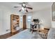 Well-lit bedroom with desk, bookcase, hardwood floors, and comfortable futon at 2031 Audubon Ne Dr, Atlanta, GA 30329