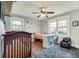 Bright bedroom with hardwood floors, whimsical wall decorations, and natural light at 2031 Audubon Ne Dr, Atlanta, GA 30329