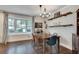 Elegant dining room with a bay window, stylish chandelier, and wood floors, perfect for entertaining at 2031 Audubon Ne Dr, Atlanta, GA 30329