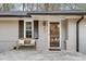 Inviting front porch with a cozy bench and decorative pillows, perfect for relaxation at 2031 Audubon Ne Dr, Atlanta, GA 30329