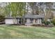 Charming single-story home with well-maintained lawn and attached two car garage at 2031 Audubon Ne Dr, Atlanta, GA 30329